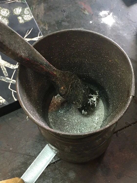 Snail shells, eggshells and silver powder in the studio of the Trường Trung cấp nghề Tổng hợp Hà Nội (Hanoi Vocational School), as used for inlays in lacquer painting.